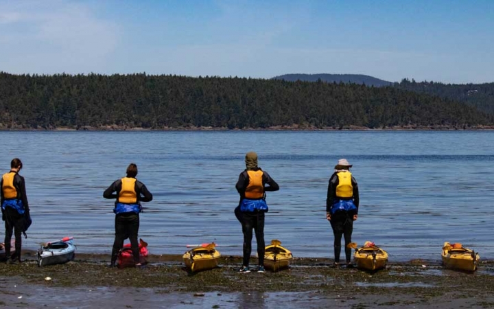 adult kayaking in the pacific northwest